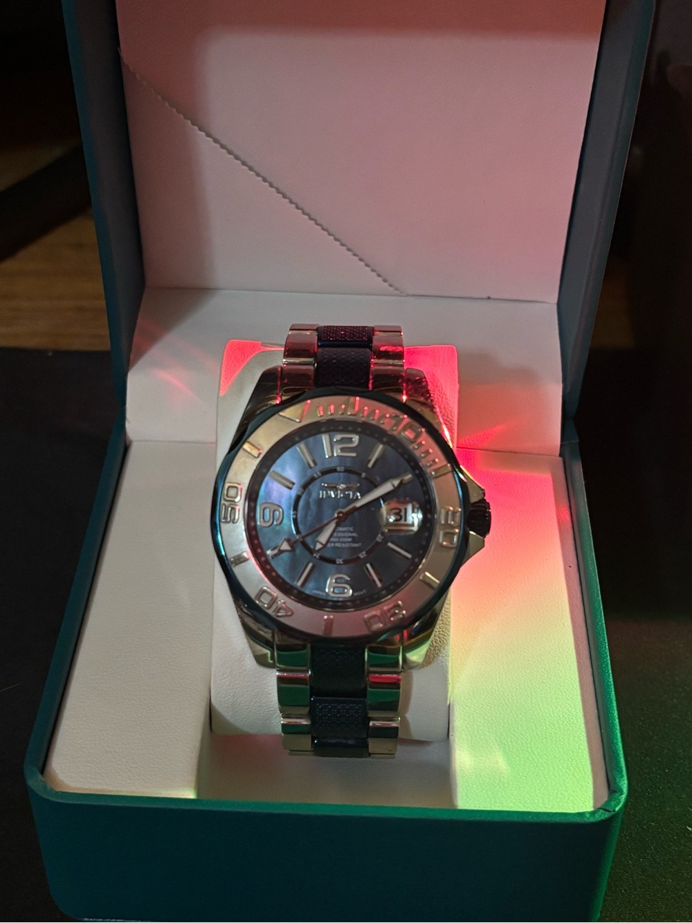 Automatic Invicta Runs, silver/blue day/date.